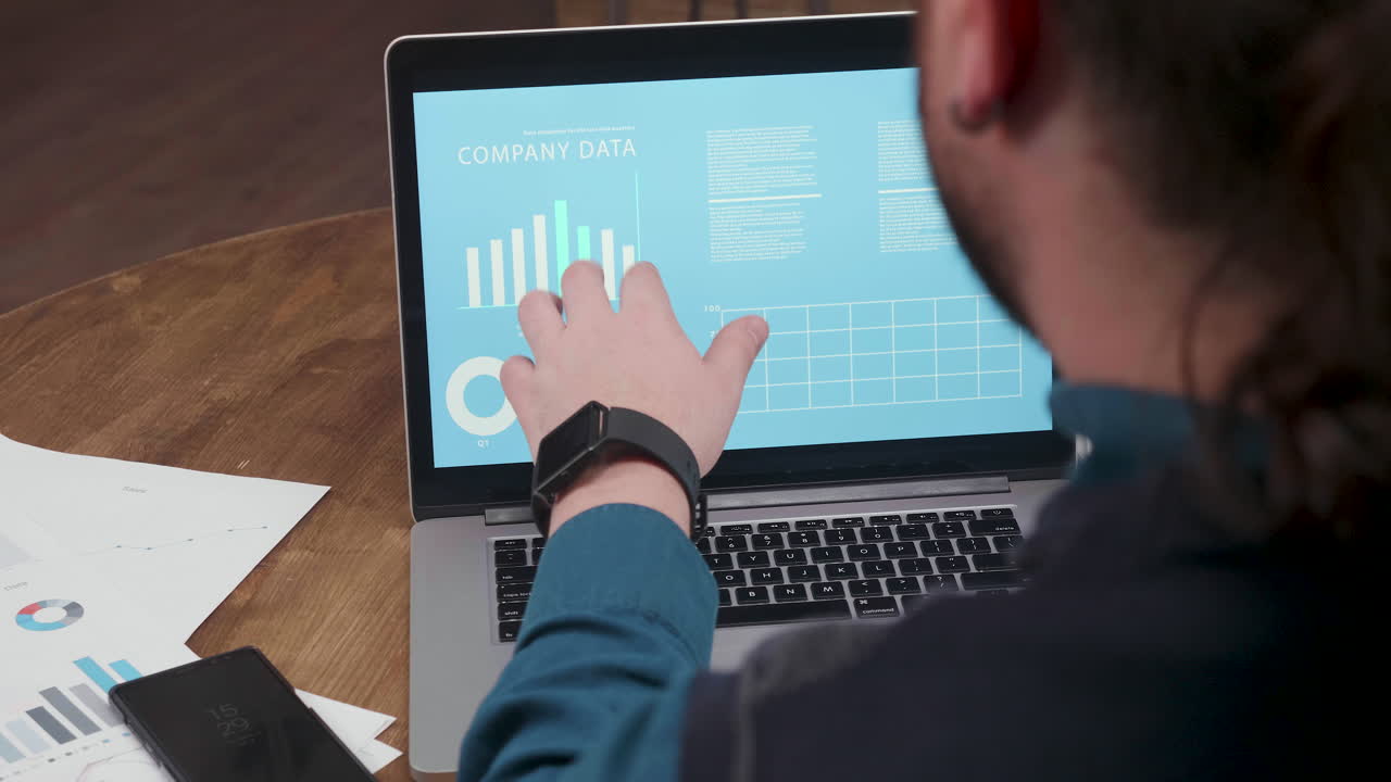 Analyzing Company Data on Laptop