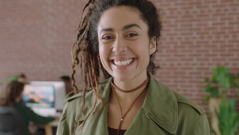 portrait of attractive young woman looking laughing cheerful looking at camera successful startup entrepreneur business woman in contemporary office