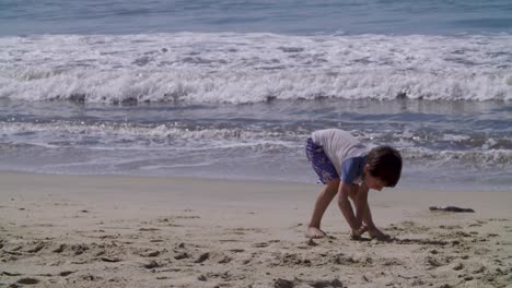 a boy plays and enjoys a day at a mexican beach