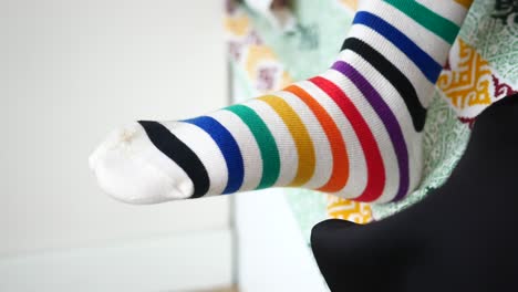 colorful rainbow striped socks on foot