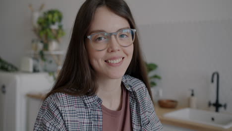 woman smiling in a kitchen