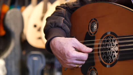 man playing oud