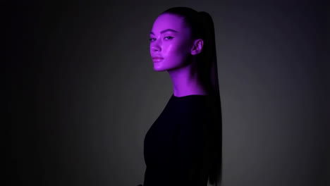 portrait of a woman with purple lighting