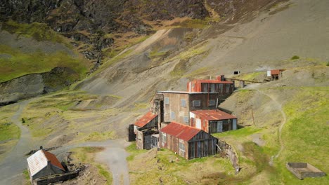 old abandoned buildings with rusty roof at force crag mine coledale beck in the english lake district