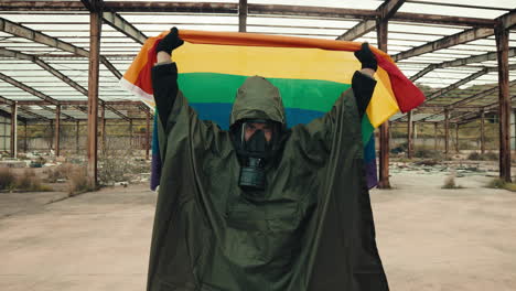 man holding the lgbtq flag