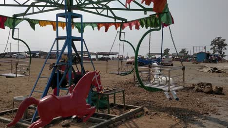 a still deserted horse carousal or merry go round at saputara gujarat india. this carousal was situated on top of a mountain land.
