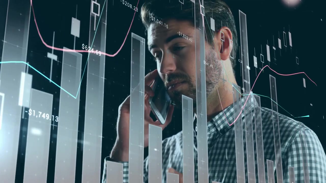 Man in checkered shirt stepping into frame behind animated charts calling to monitor market trends