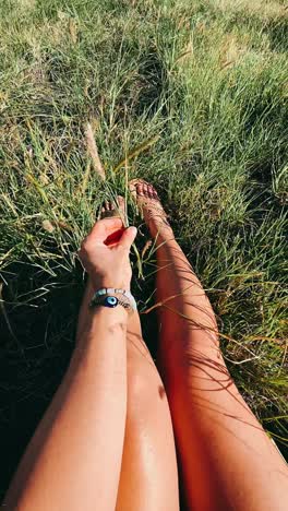 woman relaxing in a grassy field