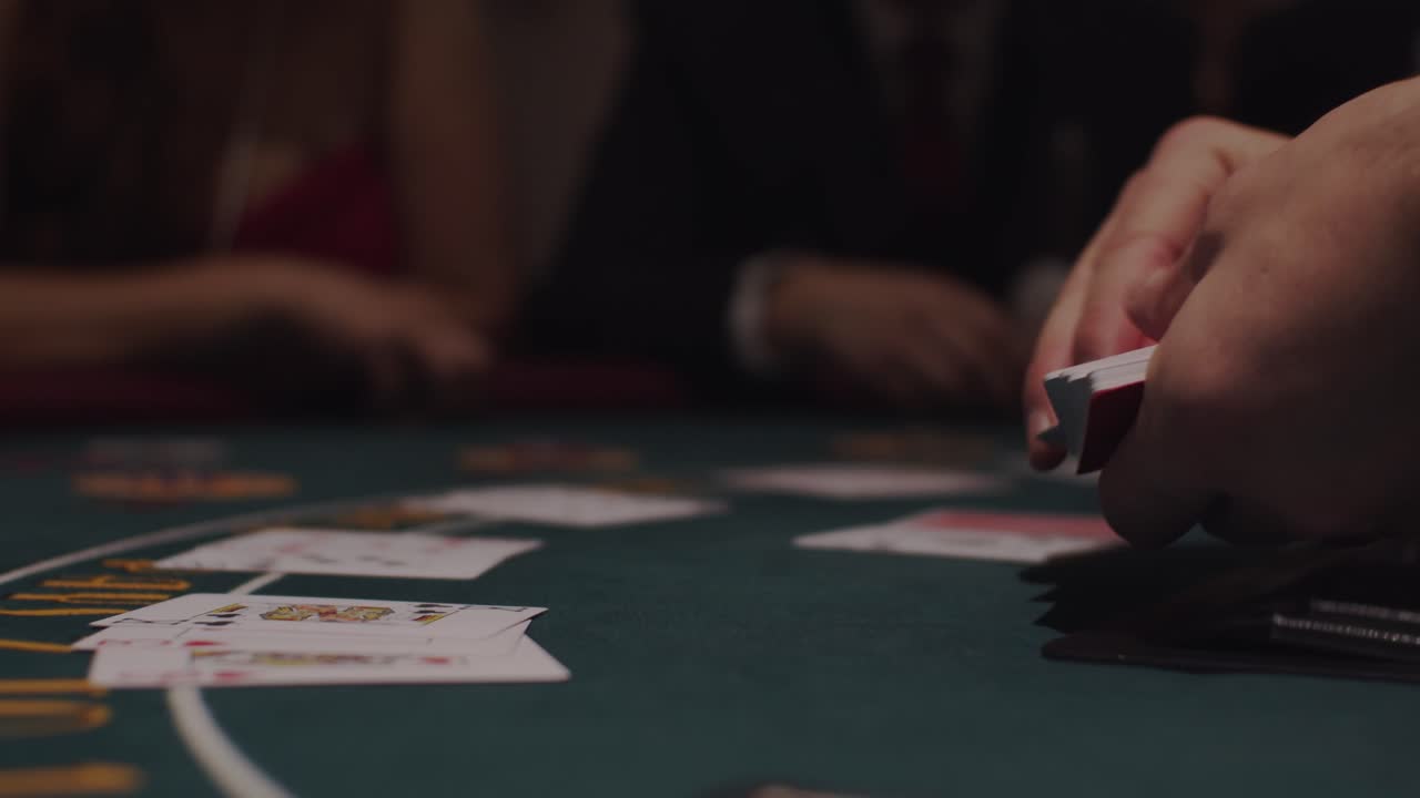 Blackjack dealer dealing cards at casino table in slow motion 1