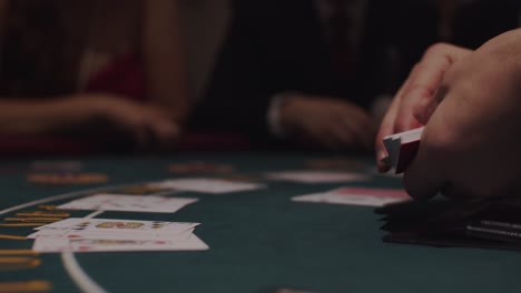 blackjack dealer dealing cards at casino table in slow motion 1