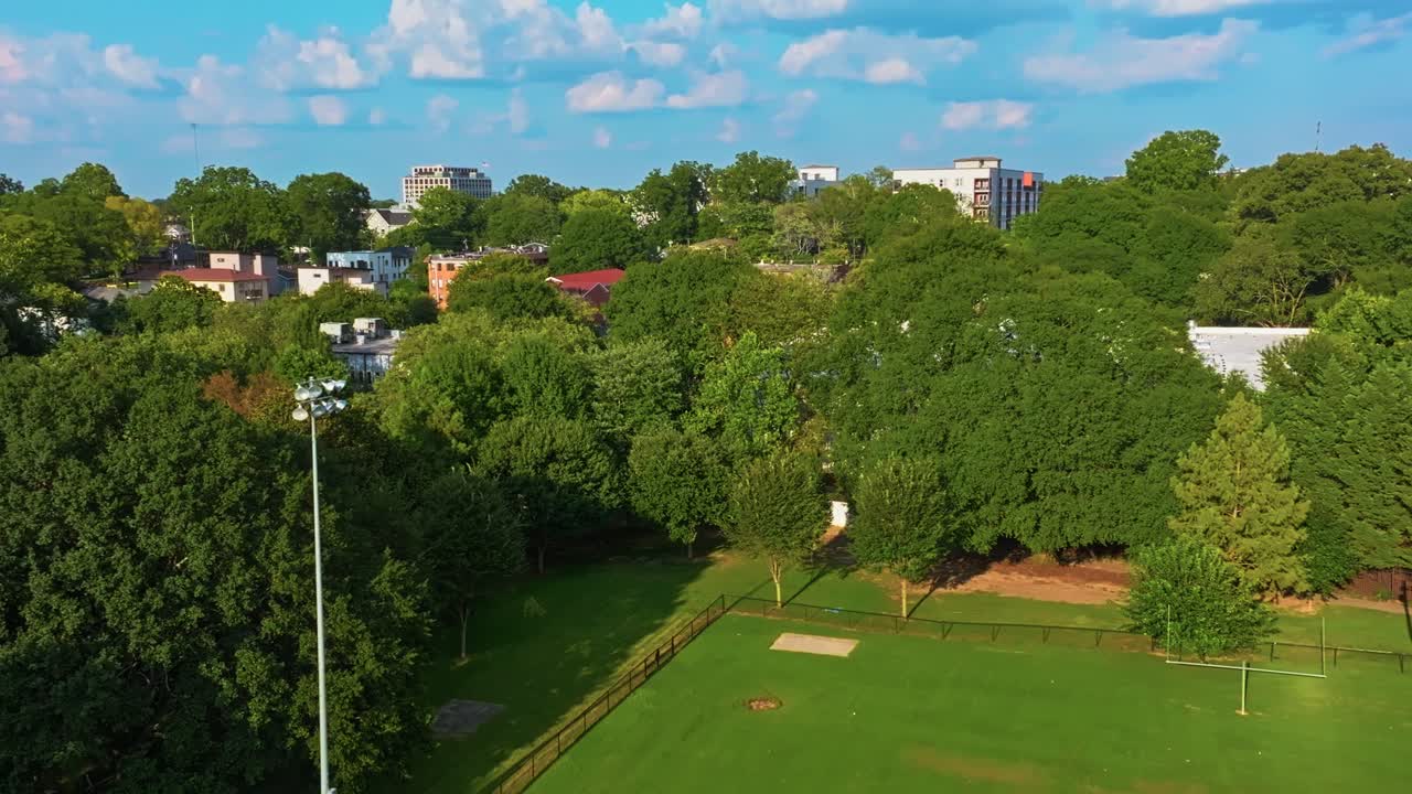 Atlanta city residential area surrounded by green trees under clear blue sky, Urban garden, Georgia, Aerial