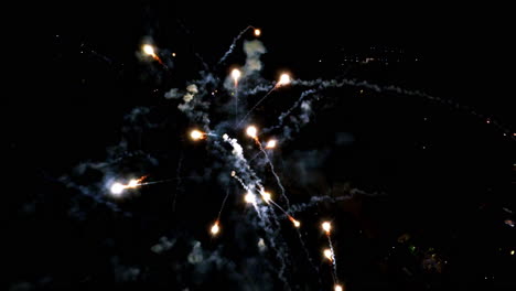 inside fireworks show with slow motion sparks in the night sky