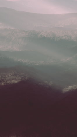 majestic mountain range cloaked in fog