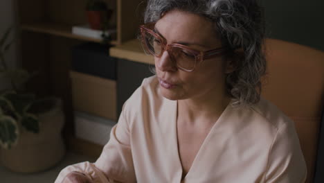 thoughtful woman in office