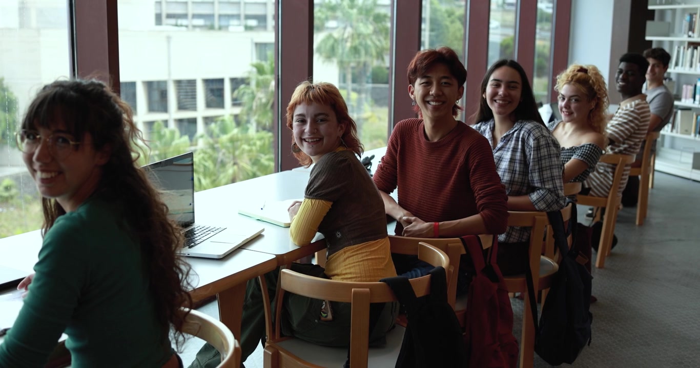 Diverse Group of Students Studying Together in a Library
