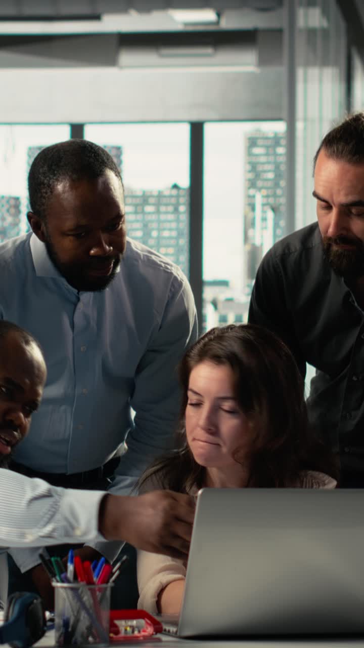 Vertical Video Diverse professionals collaborating on business planning and analytics
