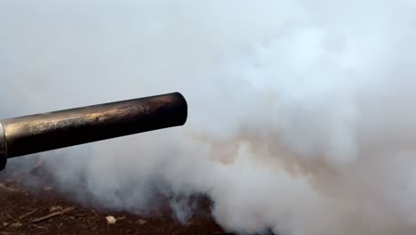 the end of the pipe from the working smoke generating machine produces white smoke to eradicate mosquitoes