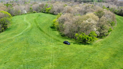 vehicle driving on scenic farm field during property