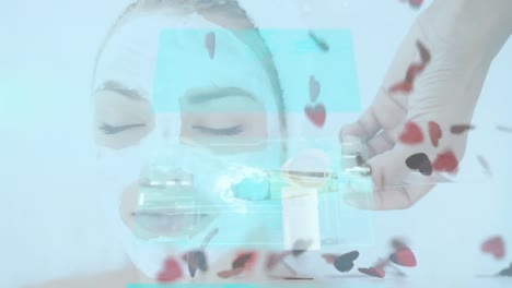 animación de procesamiento de datos y corazones sobre mujer caucásica aplicando máscara facial de belleza.