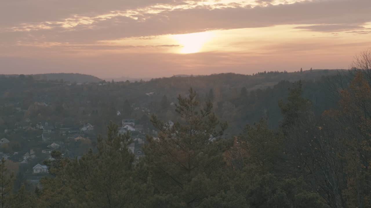  Young couple of hikers with backpacks reaching the top of the mountain Close-up