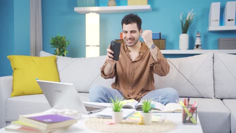 Young-man-reading-good-news-is-happy-and-cheerful.