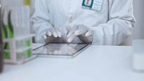 Science,-tablet-and-hands-of-person-in-laboratory