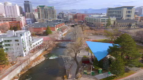 aerial trucking to the right over the truckee river in downtown reno, nevada