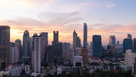 time lapse day to night of modern building in business area with motion zoom at bangkok,thailand