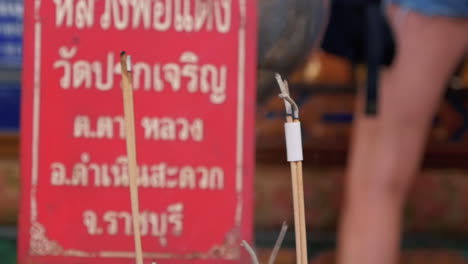 ash falling from a burnt incense stick in bangkok, thailand