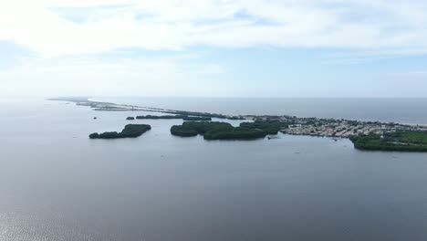 Drone,-pan-shot-of-Cienaga-Magdalena-by-the-sea-side