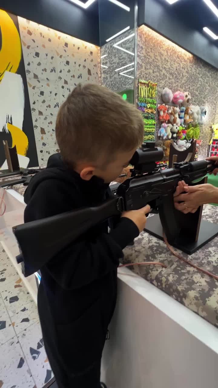 Boy playing with a toy gun