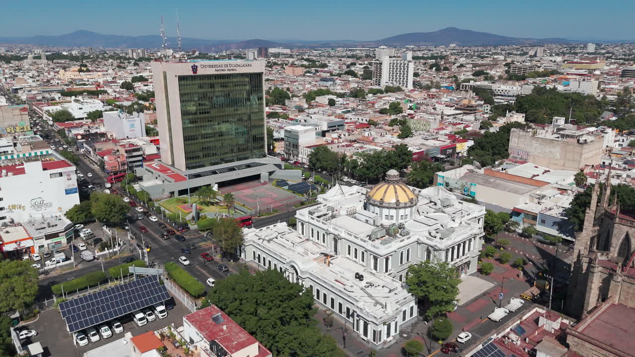 Aerial view of the Rectoria Building and the Museo de las Artes in Guadalajara, Jalisco, Mexico, with the traffic of the Enrique Diaz de Leon avenue