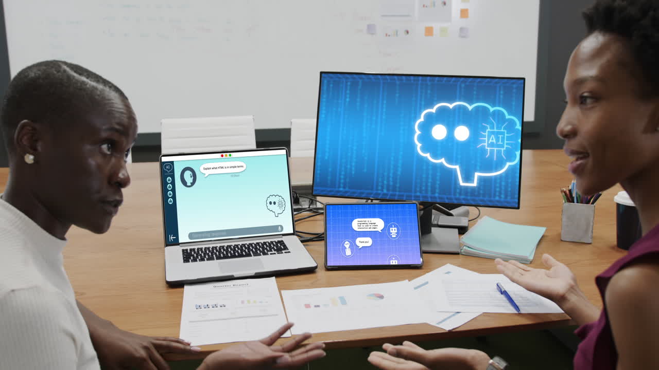 African american businesswomen using computer with data processing in office