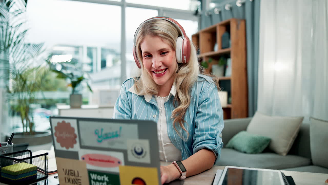 Woman with headphones using laptop for video call