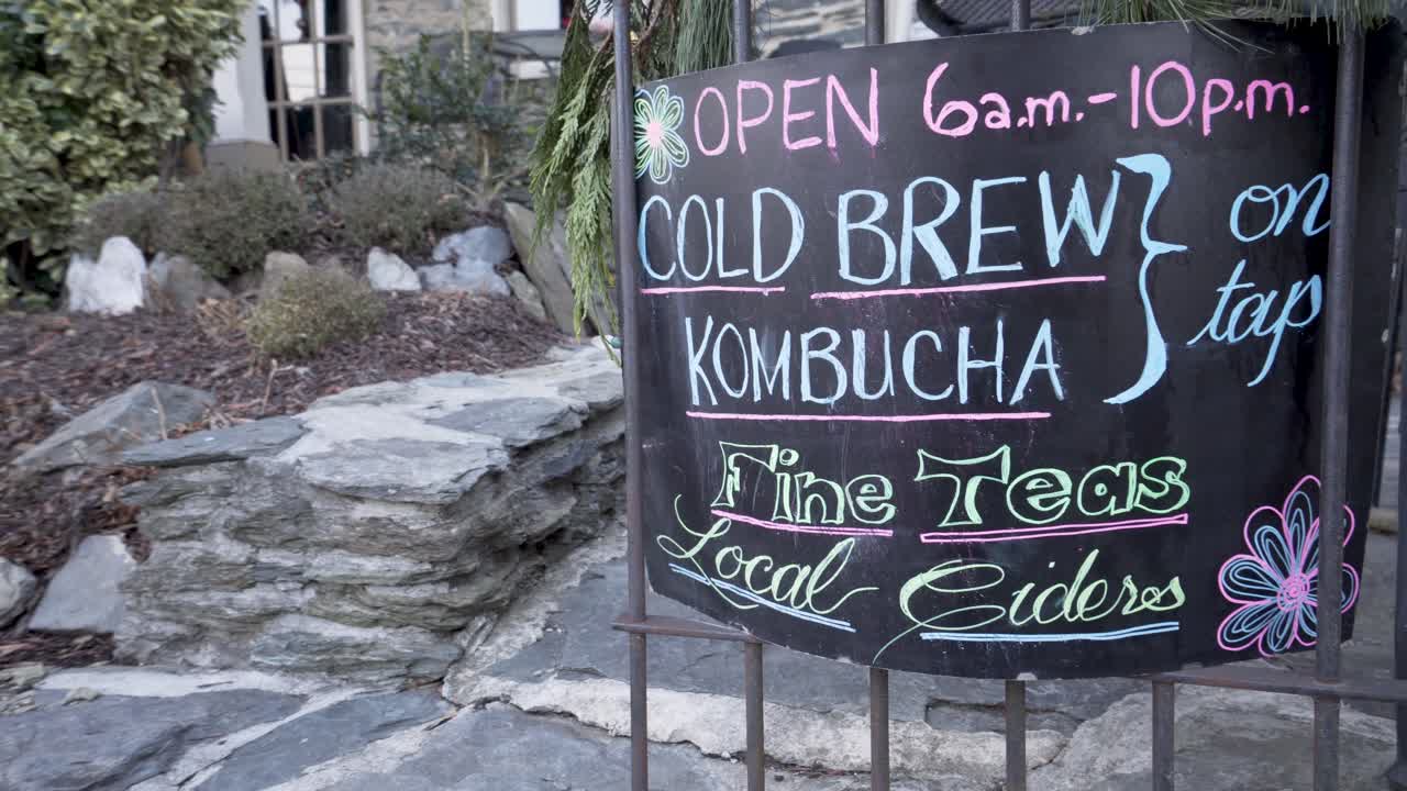 Sign advertising cold brew, kombucha, fine teas, and local ciders