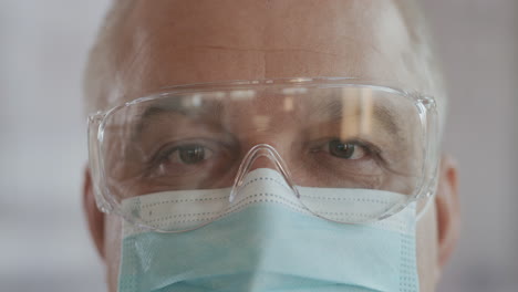 portrait of confident doctor woman face close-up. eyes with safety glasses and protective mask. research laboratory officer. 2019 novel coronavirus (2019-ncov) covid-19 pandemic isolation concept.