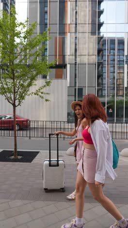 two women traveling through city