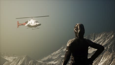 woman and helicopter in winter mountains