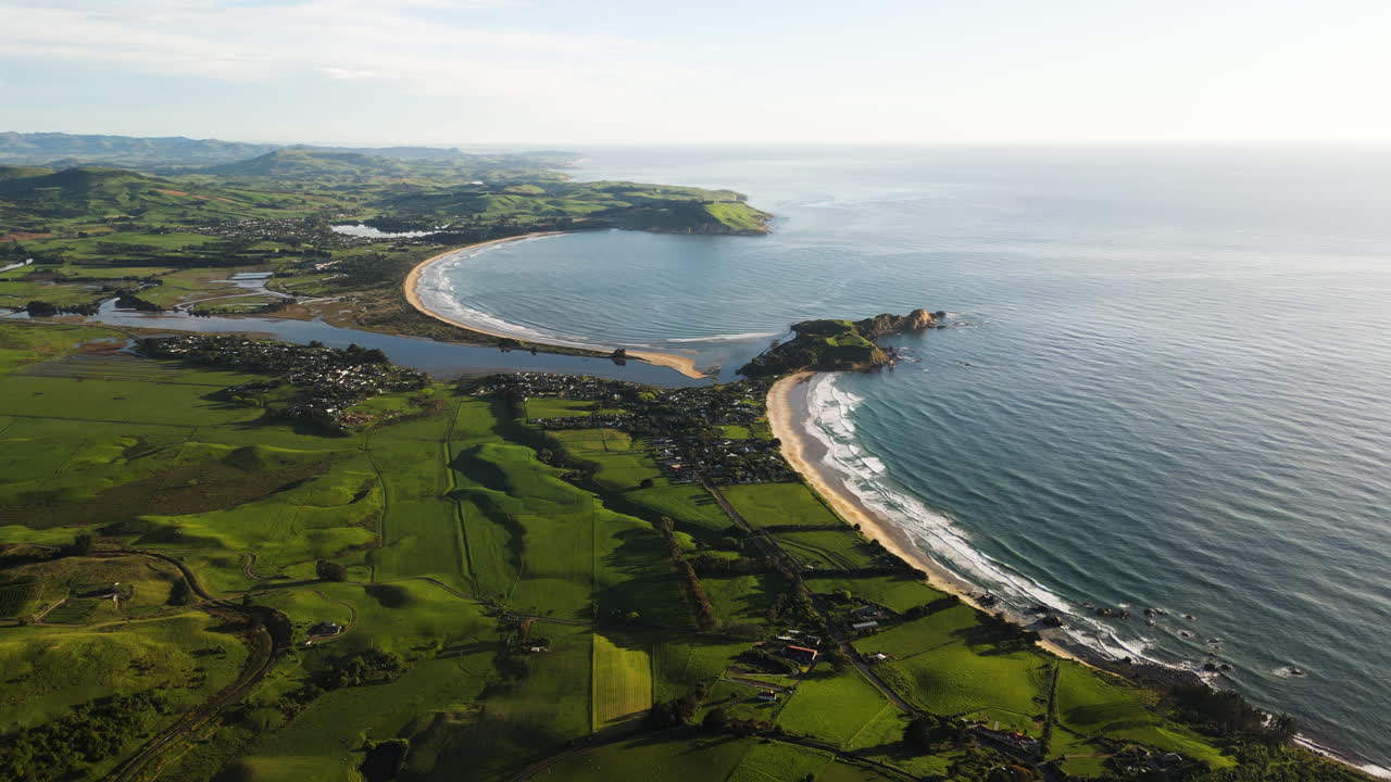 Aerial view of Karitane township and mouth of Waikouaiti River at ...