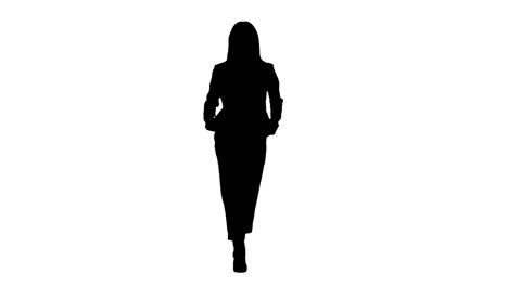 walking businesswoman with hands in pockets, alpha channel