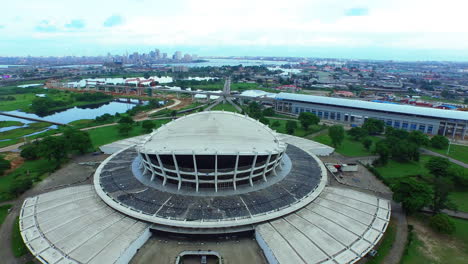 lagos, nigeria skyline and the national theater - pullback aerial flyover