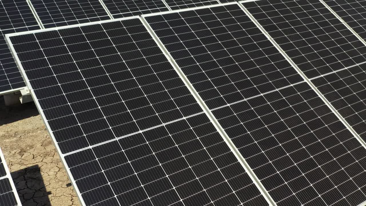 aerial close up view solar batteries. Large economical photovoltic panel producing clean energy from sun.4k video