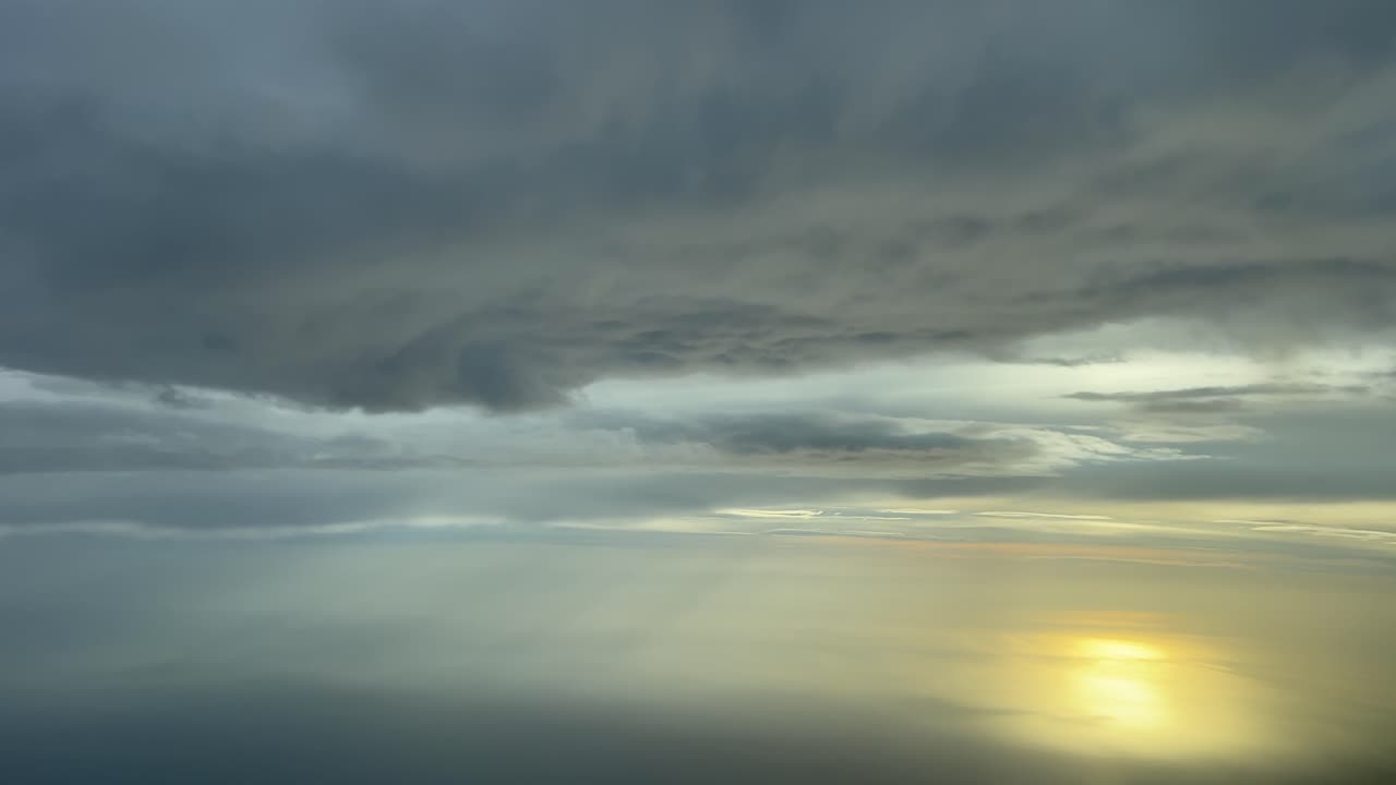 Awesome sunset over the Mediterranean Sea recorded from a jet&rsquo;s cockpit while flying under a layer of clouds at 7000m high