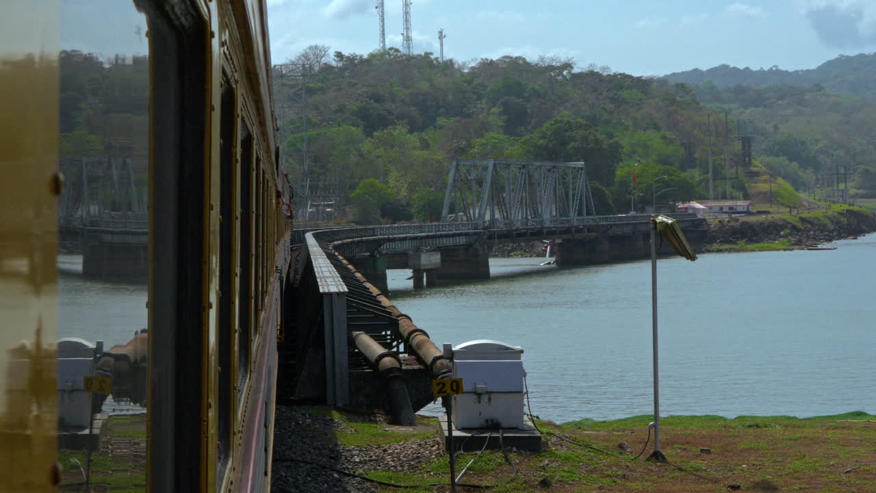 slowmotion shot looking back after passing over the Gamboa Bridge in Panama