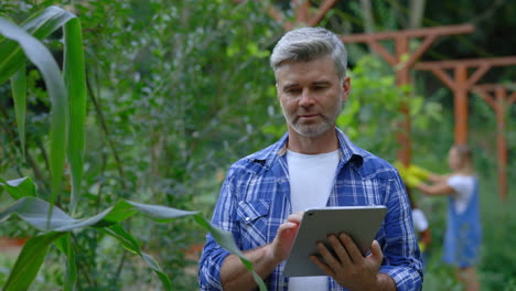 farmer using tablet in a garden