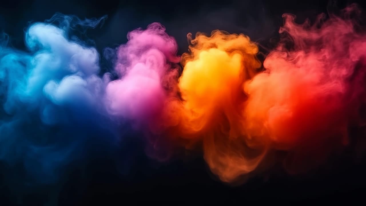 Artistic colorful smoke swirls. Vibrant plumes of colored smoke blend beautifully against a dark background, creating an artistic visual effect.