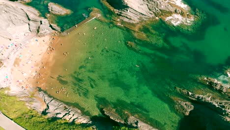 ascending above rocky bay as tourist enjoy the