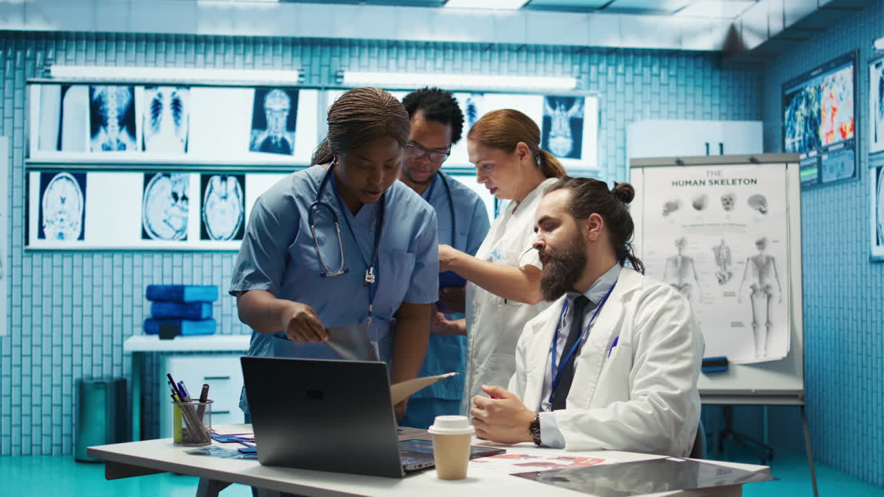 Medical team discussing x-rays in a hospital setting
