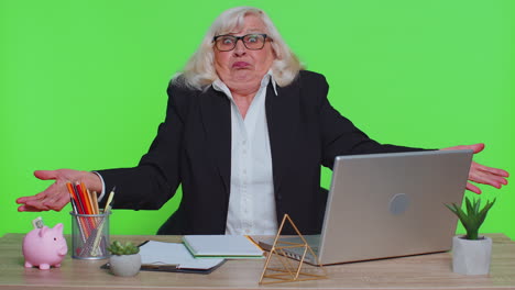 senior office businesswoman raising hands, asking why, what reason of failure irritation by troubles