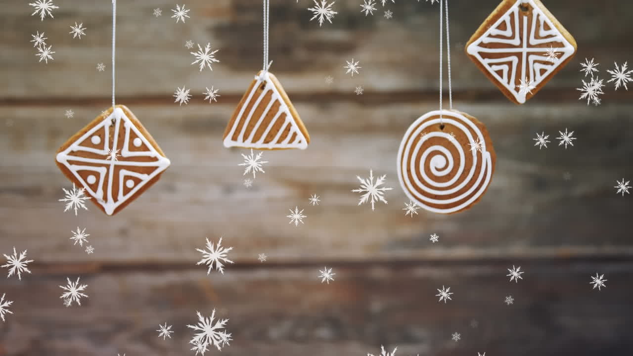 animación de gingerbreds navideños y nieve sobre las tablas de escritorio fondo